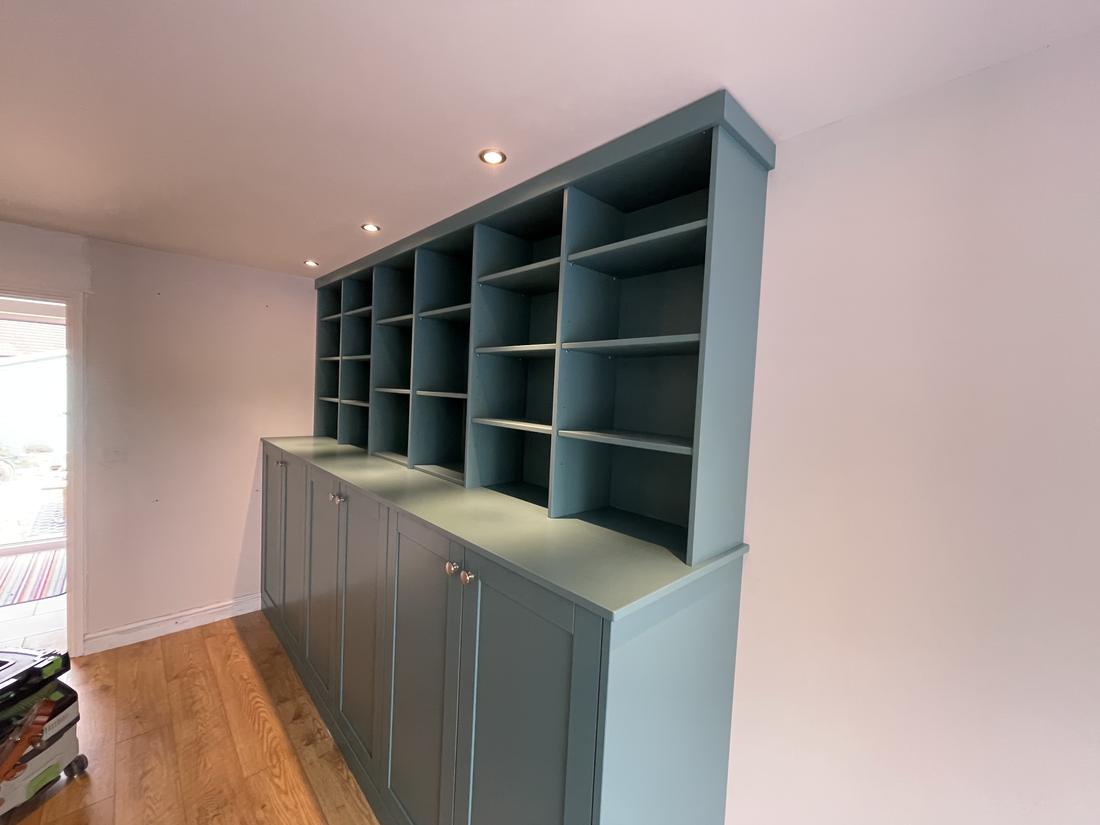 Duck-egg painted bookcase and cabinets
